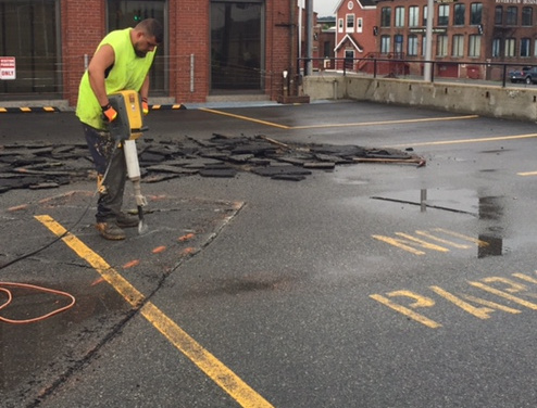 City Sealcoating commercial lot asphalt repairs